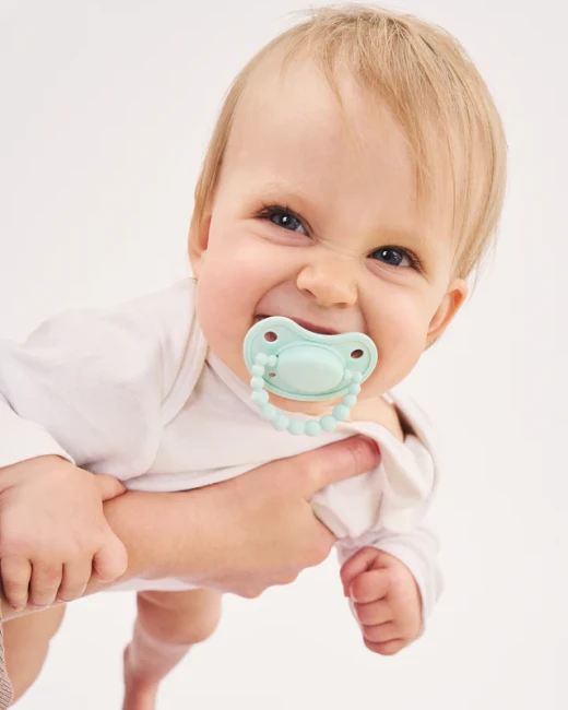 luu-kids-smoczek-pozycjonujacy-vivid-mint-1.webp